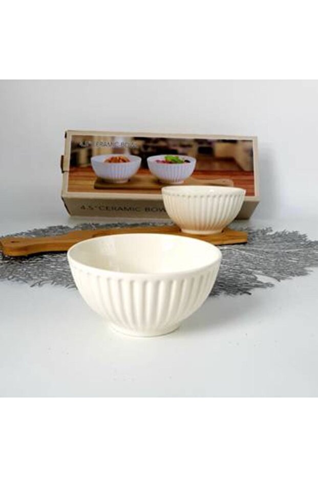 Two ceramic plates with a wooden base, each plate measures 12 cm in diameter.