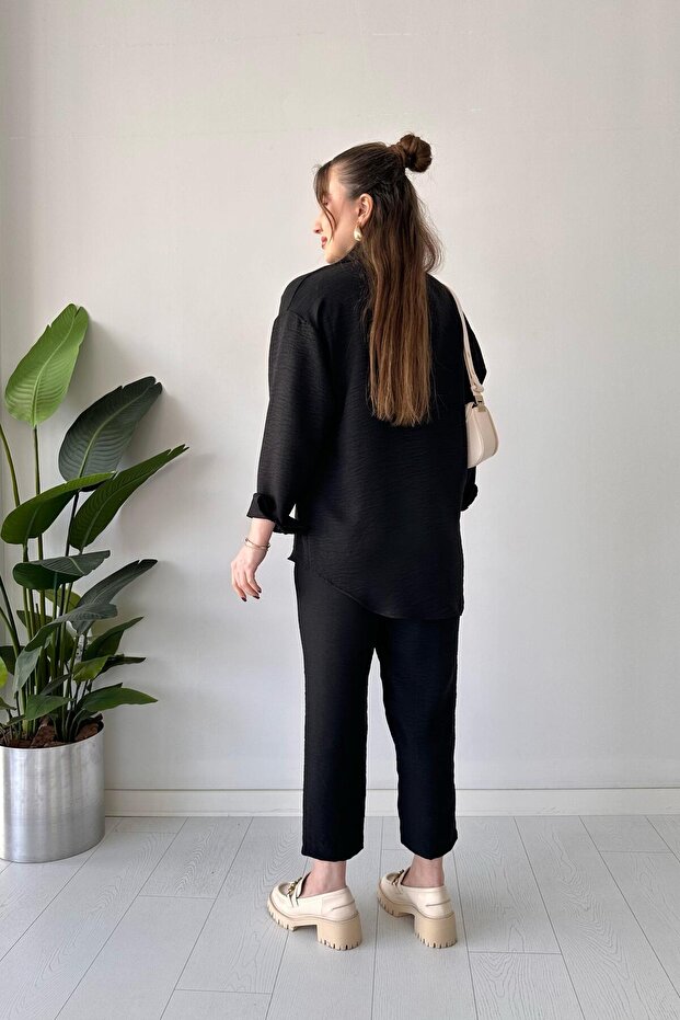 بدلة كتان مزدوجة باللون الأسود - 5