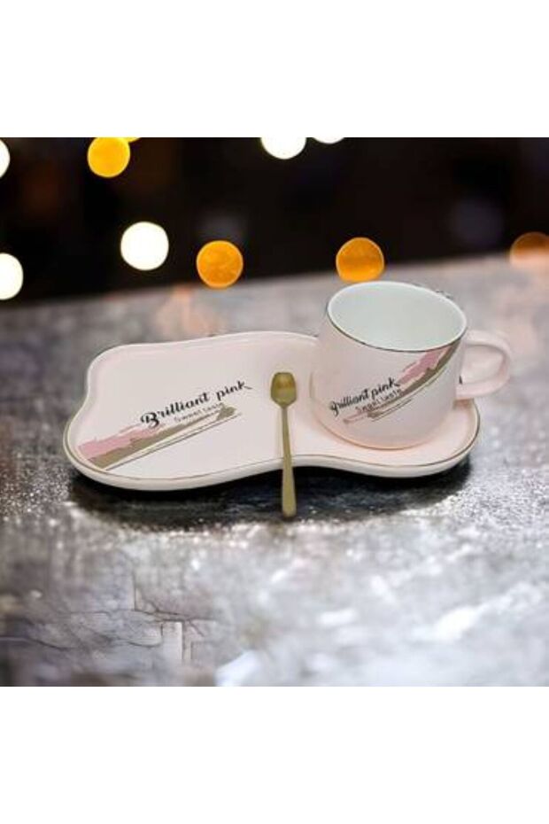 A set of a cup, spoon and saucer, available in two colors: white and pink.
