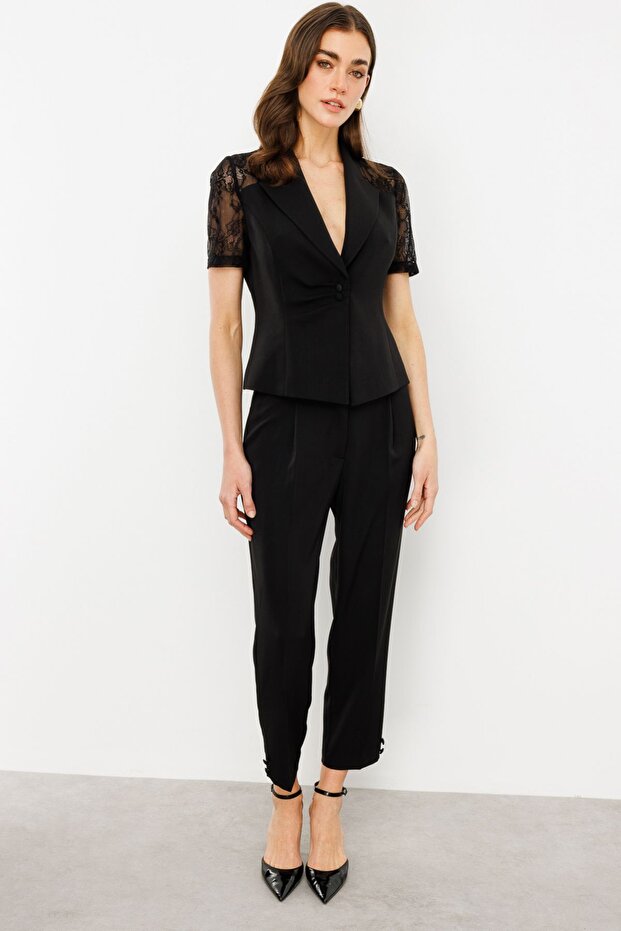 Pocketless Trousers with Button Detail on the Leg