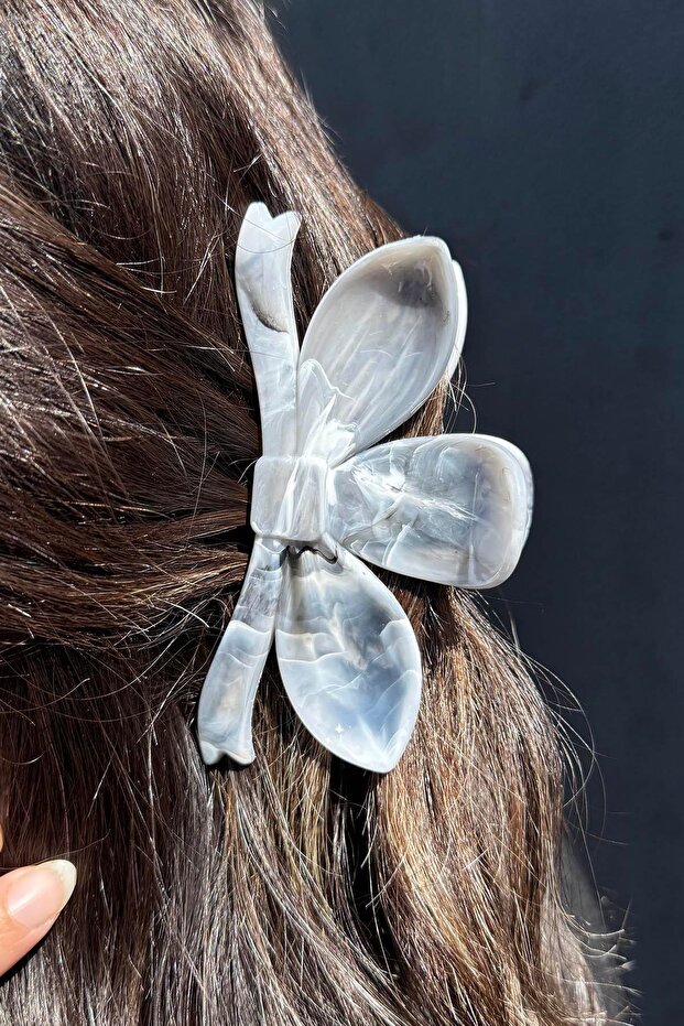 مشبك مزلاج على شكل عظمة من الرخام باللون الرمادي - 1