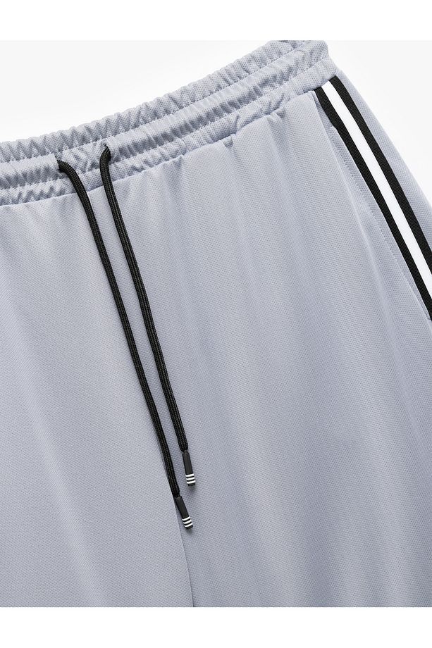 Şerit Detaylı Cepli Beli Bağcıklı Oversize Spor Şort - 6