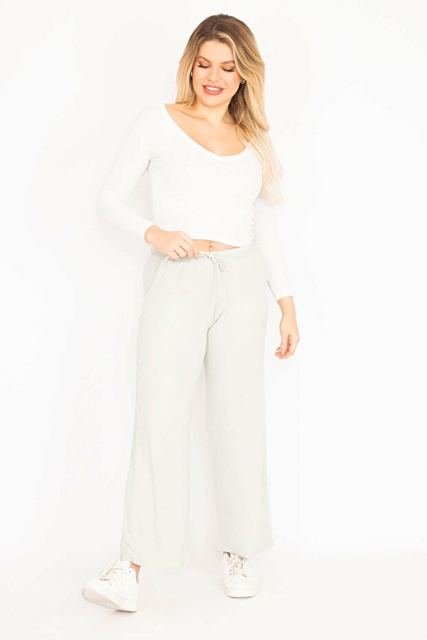 Zielone, koronkowe spodnie damskie w dużych rozmiarach, z paskiem w talii 65n35103 - 7