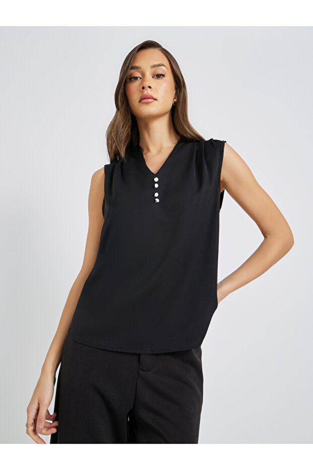 بلوزة سادة بدون أكمام بأزرار أمامية - 1