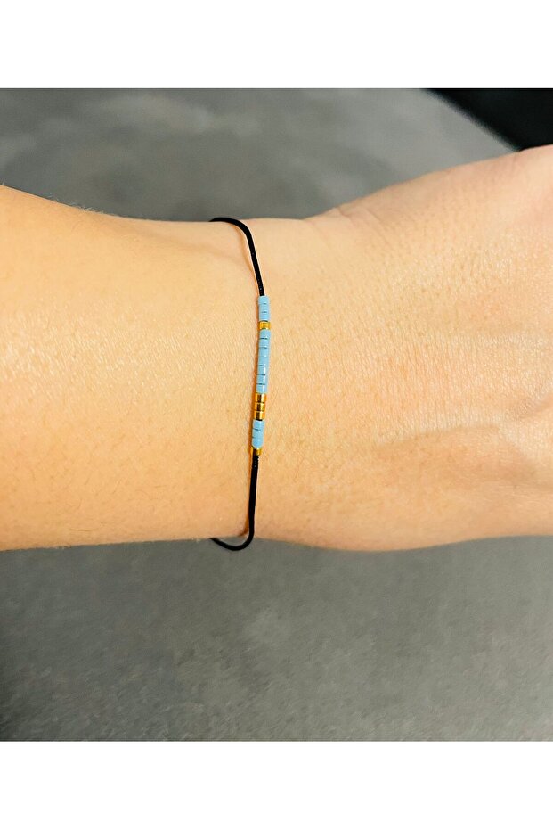 Adjustable bracelet on black cord with Morse code message: Dream