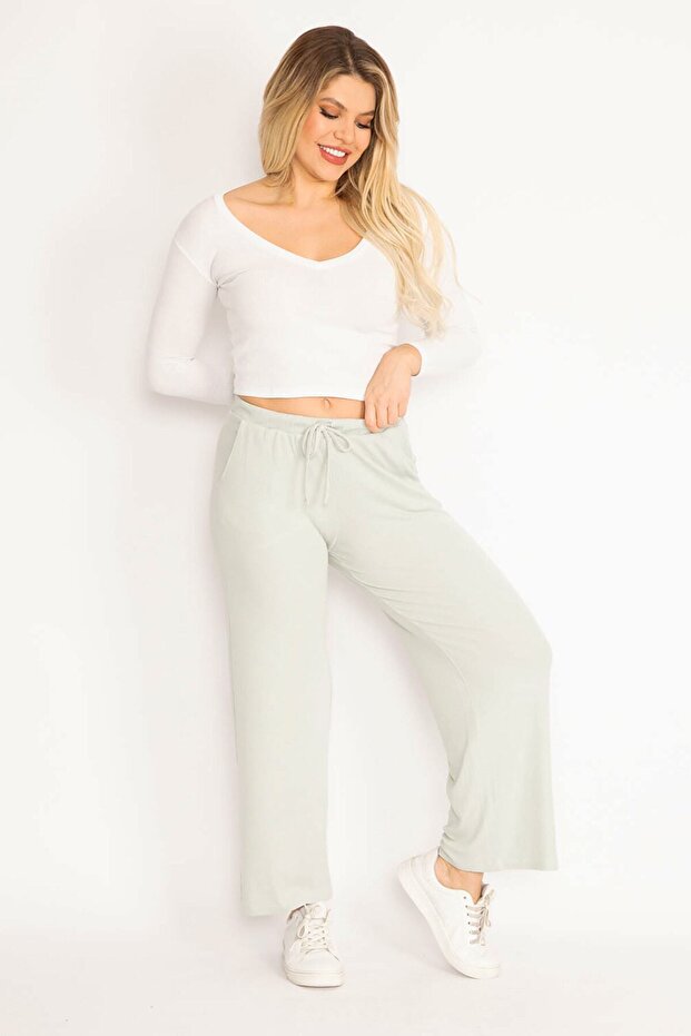 Zielone, koronkowe spodnie damskie w dużych rozmiarach, z paskiem w talii 65n35103 - 3