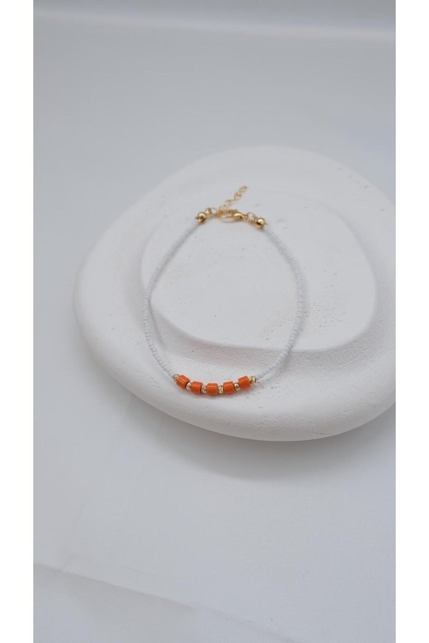 White Anklet with Orange Beads and Dorica Detail