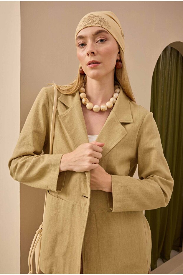 سترة بليزر من الكتان باللون الجملي الفاتح - 1
