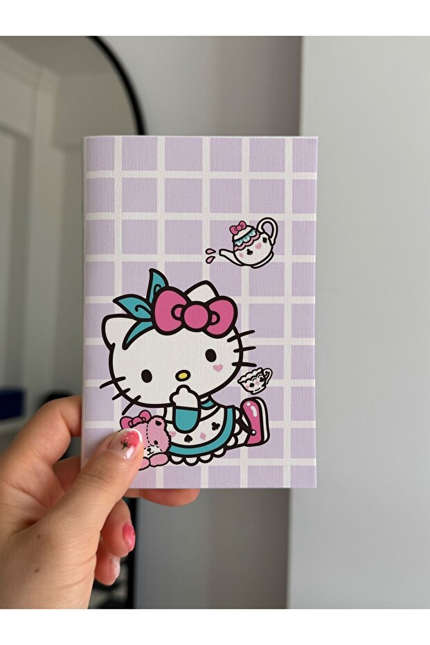 دفتر ملاحظات صغير غير مُجلد من كيتي تي - 1