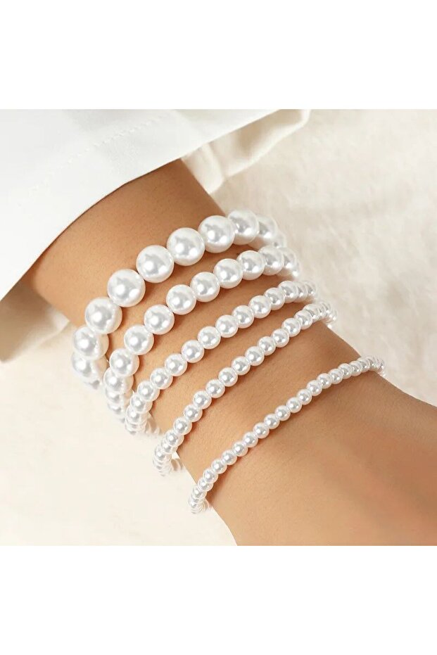 Complete Your Elegance with This Exquisite Set of 5 Pearl Bracelets