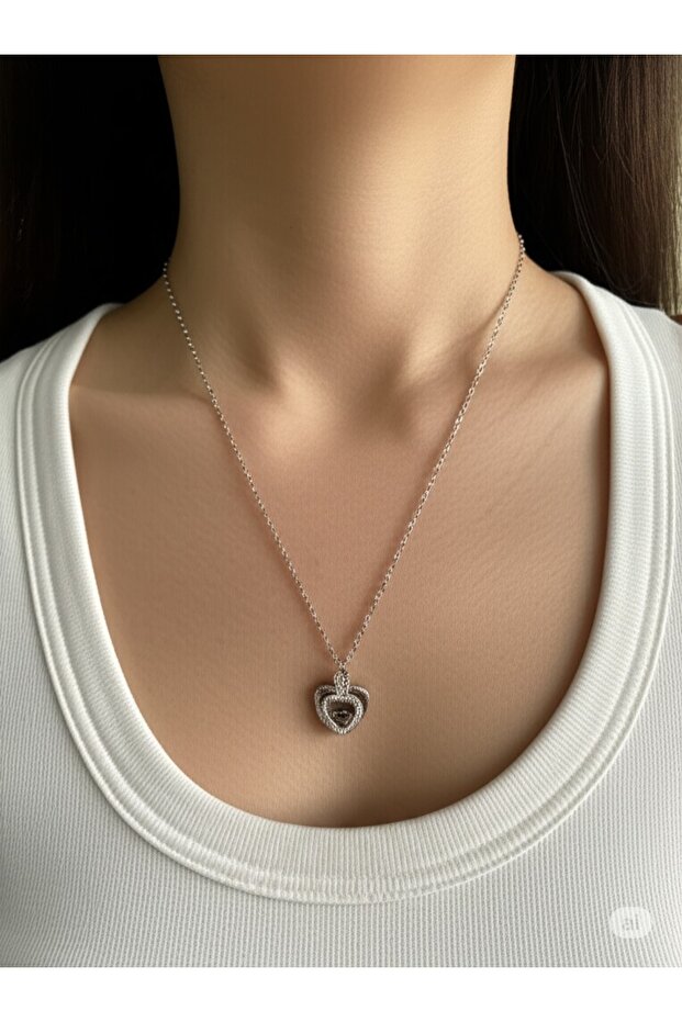 Steel Rotating Heart Magic Necklace Elegant Design with Blue Stone