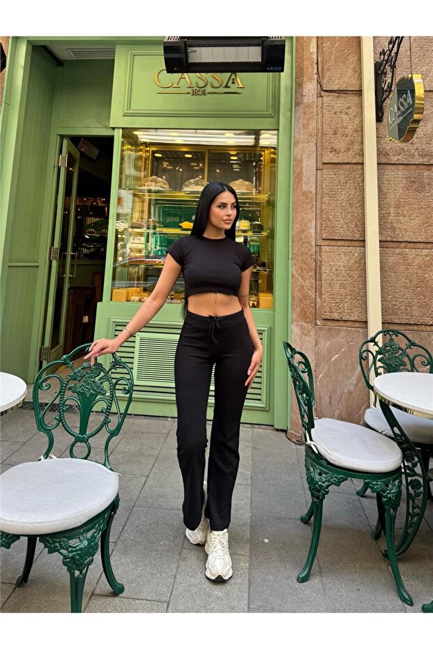 بدلة قصيرة من البولي أميد والإيلاستين باللون الأسود - 6