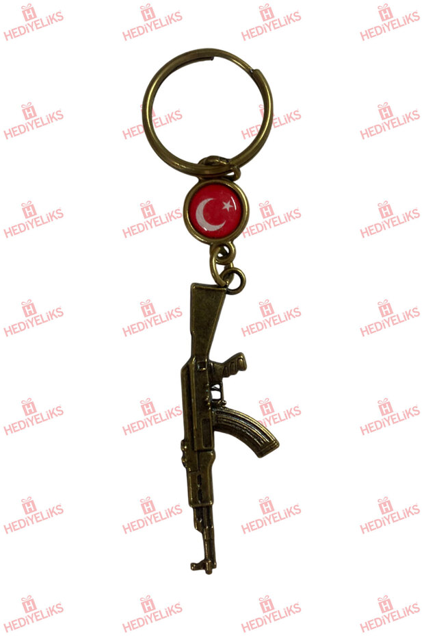 سلسلة مفاتيح هدية ذات طابع ذهبي مع شكل مسدس AK47 CS