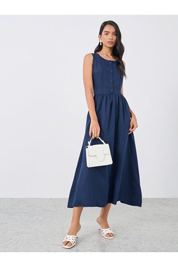 فستان ميدي سادة بدون أكمام وأزرار - 1