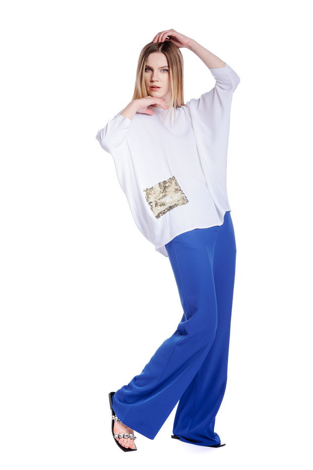 Oversized white blouse with sequin pocket