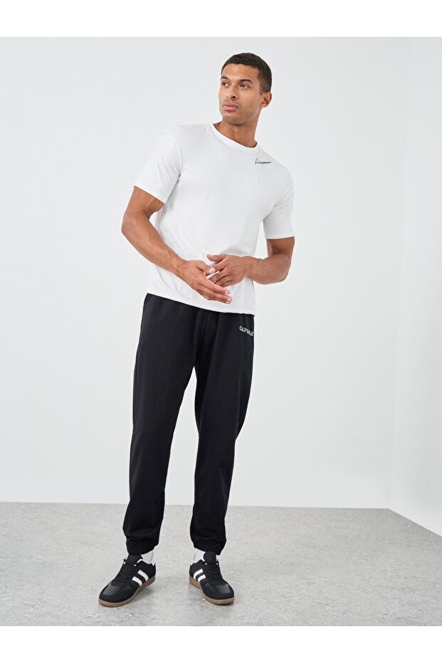 بنطال رياضي كبير الحجم بنقش مطبوع وأكمام مطاطية - 2