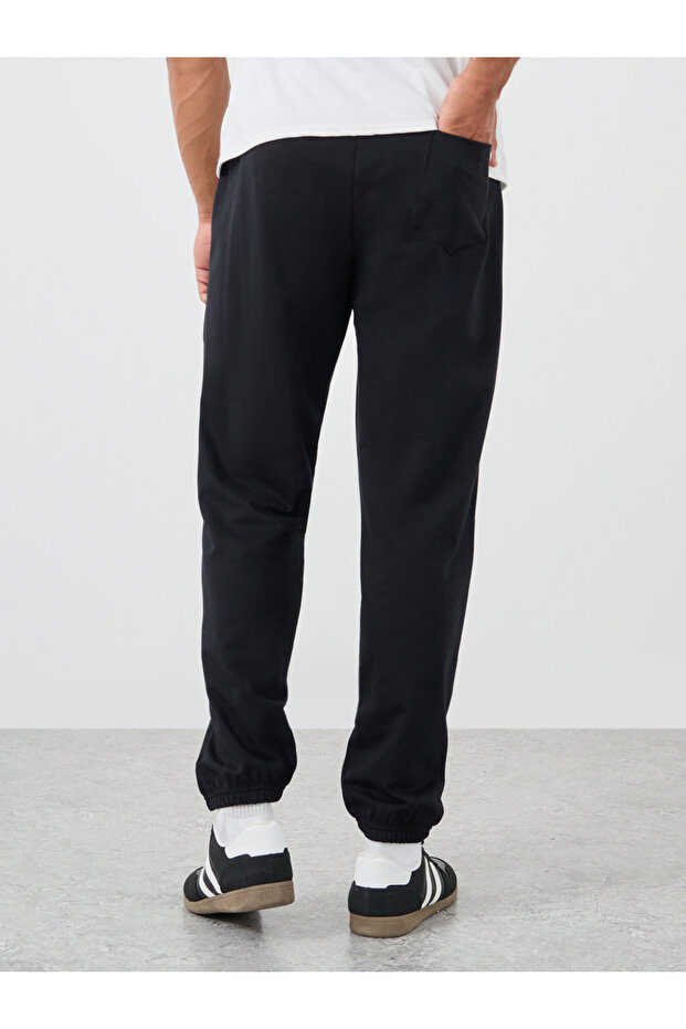 بنطال رياضي كبير الحجم بنقش مطبوع وأكمام مطاطية - 4