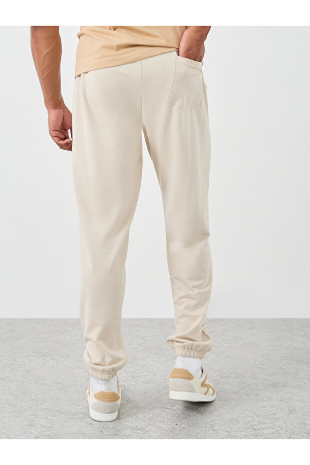 بنطال رياضي كبير الحجم بنقش مطبوع وأكمام مطاطية - 4