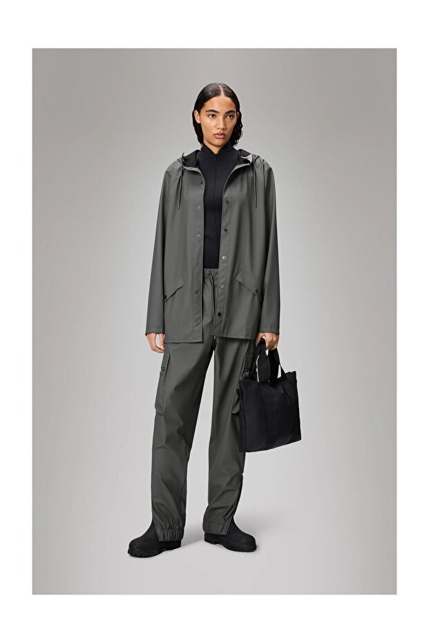 Waterproof jacket is cut from Rains’ signature PU fabric and features ultrasonically welded seams. - 1