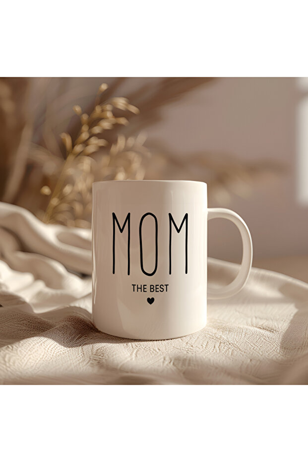 كوب مطبوع من السيراميك الأبيض بتصميم Mom The Best سعة 330 مل