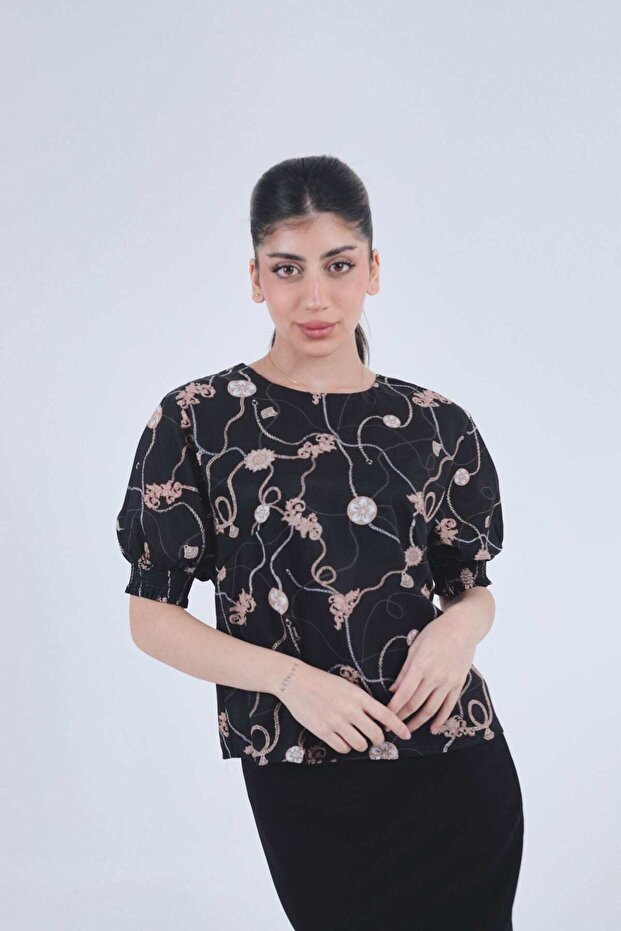 بلوزة نسائية مطبوعة بأكمام منفوخة
