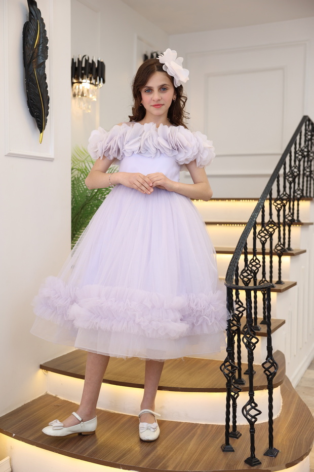 Long girl's evening dress with layered sleeves, floral print, off-the-shoulder, stone details, and ruffled skirt