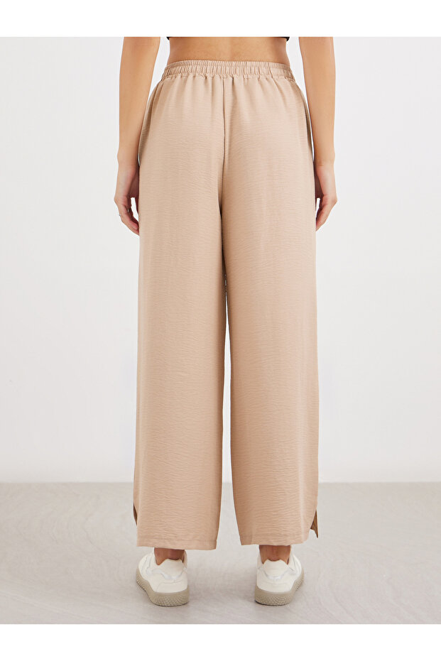 بنطال واسع الساق برباط خصر سادة - 4