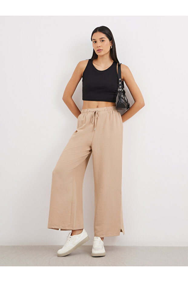 بنطال واسع الساق برباط خصر سادة - 1