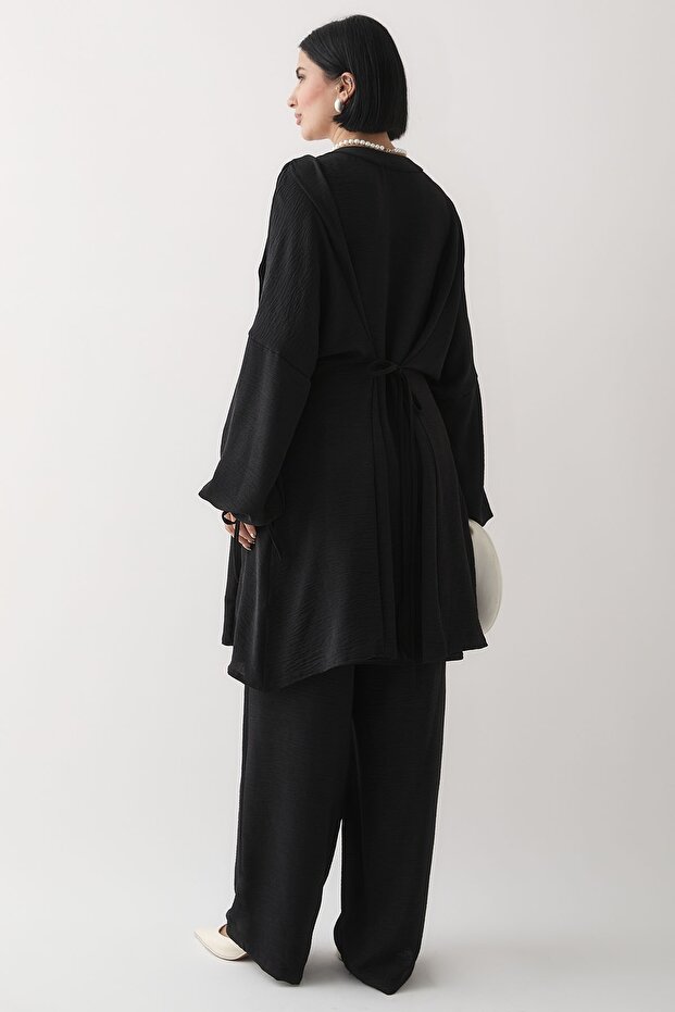 بدلة أيروبين سوداء برباط وأكمام مضلعة - 5