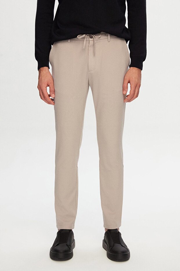 بنطلون Ds Damat Slim Fit بيج بخصر مطاطي وسحاب من الليكرا مريح للركض