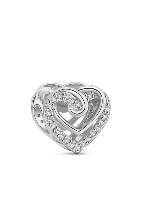 Nest within nest heart silver charm