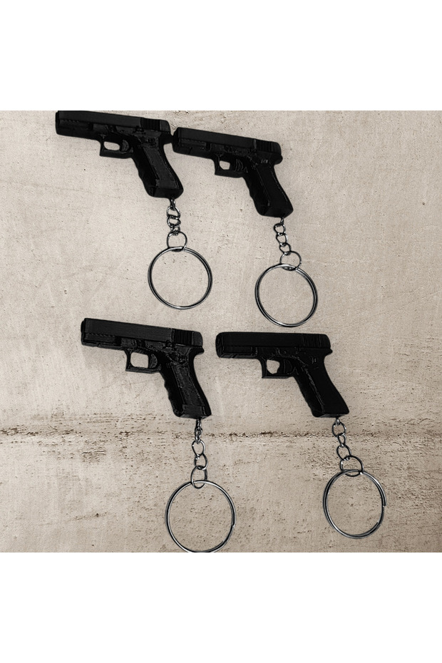 Set of 4 Pistol Shaped Keychains – Retro & Decorative Design - 1