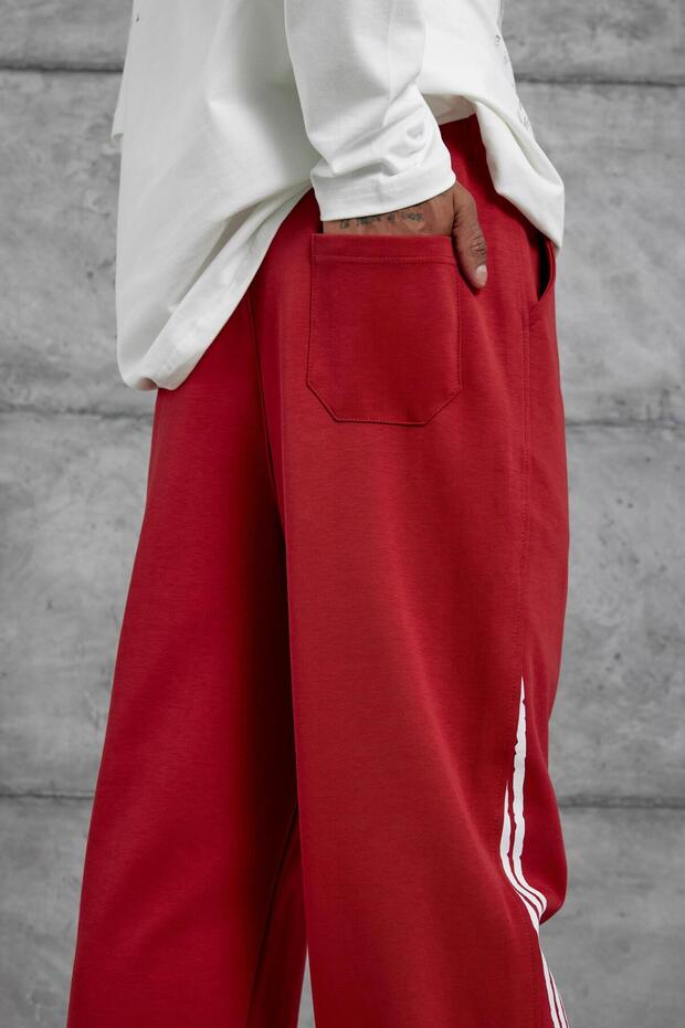 بنطلون رياضي رجالي أحمر مطبوع عليه عبارة 'Retured' - 5