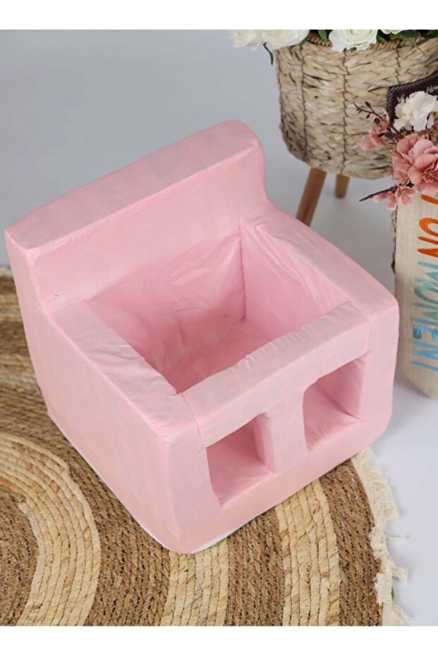 A comfortable foam chair specially designed to help babies learn to sit. - 1