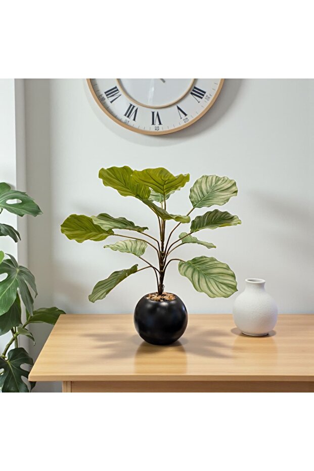 Artificial plant with tropical leaves in a 60cm round pot