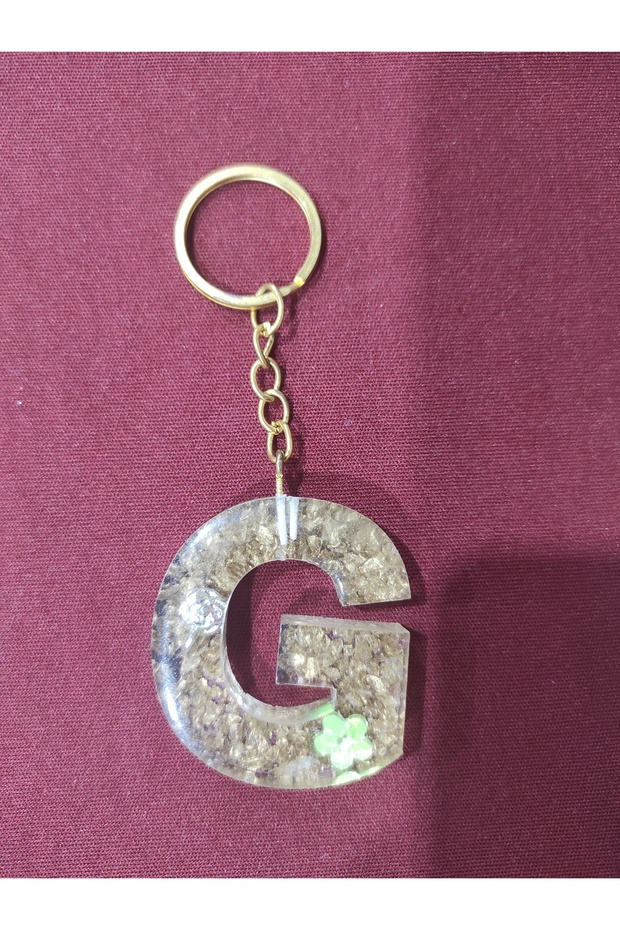 هدية سلسلة مفاتيح إيبوكسي بحرف "G".