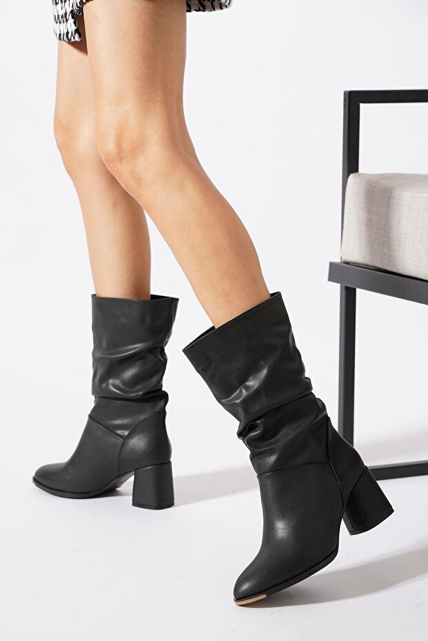 Dares women's black leather ankle boots with buckle detail