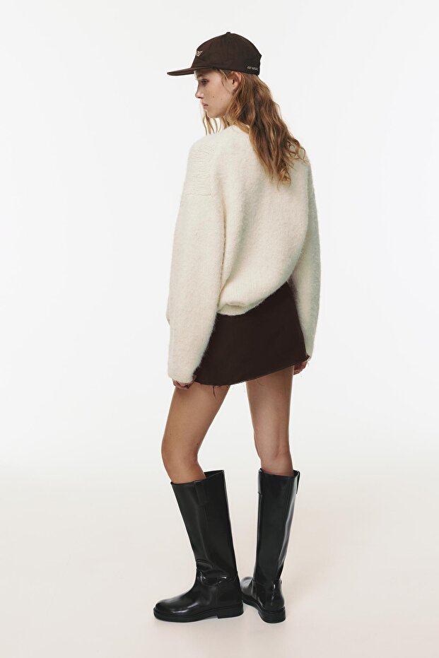 Püsküllü etek uçlu cepli mini etek - 4