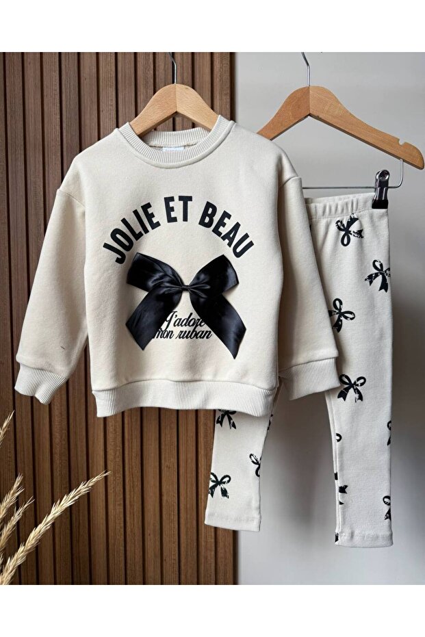 The Most Trendy Model of the Season Is a Girls' Set with a Three-Thread Sweatshirt Without Sharding and Leggings with a Bow Pattern. - 3