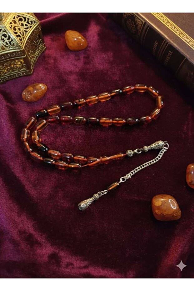 سبحة من حجر العنبر الناري بقطع كبسولي وتدرجات لونية غنية