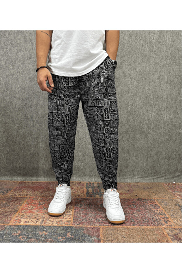 Baggy Pants with Elastic Waistband, Pocket, Ribbed Detail and Patterned Design.
