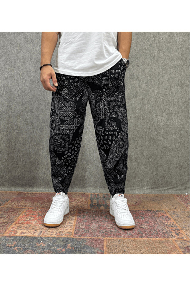 Baggy Pants with Elastic Waistband, Pocket, Ribbed Detail and Patterned Design.