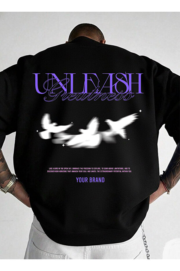 سويت شيرت قصة فضفاضة يوني سكس برقبة دائرية UNLEASH مطبوع