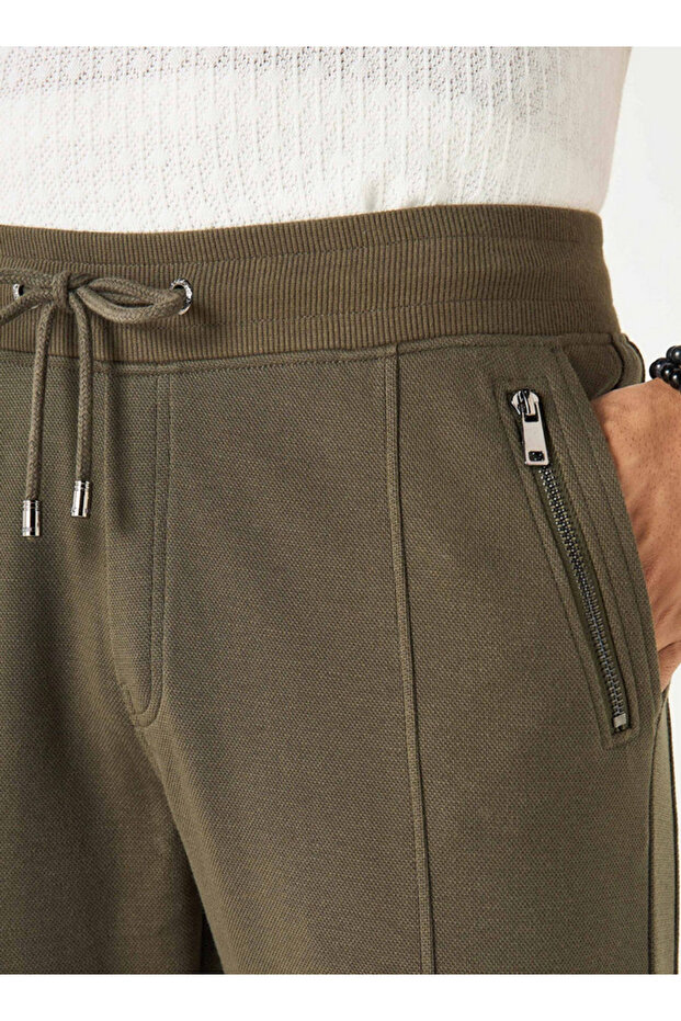 بنطال رياضي منسوج بإغلاق برباط وجيوب - 4