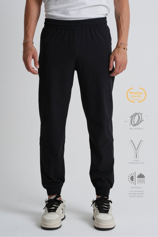 Black Elasticated Leg, Lace-Up Waist, Zippered Pockets, Standard Fit Men's Tracksuit Bottoms