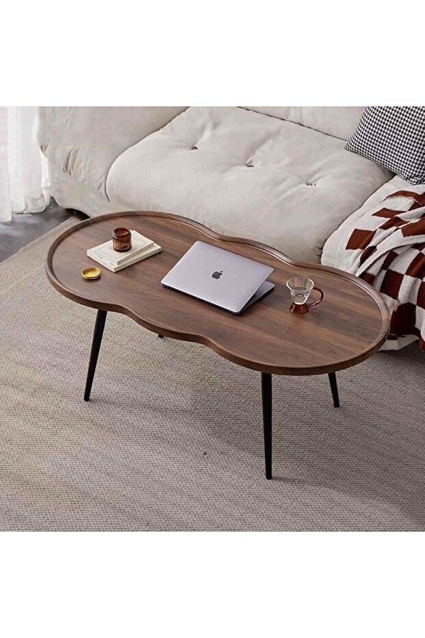 Irregular coffee table with raised edges and four metal legs, curved corner design - impact resistant
