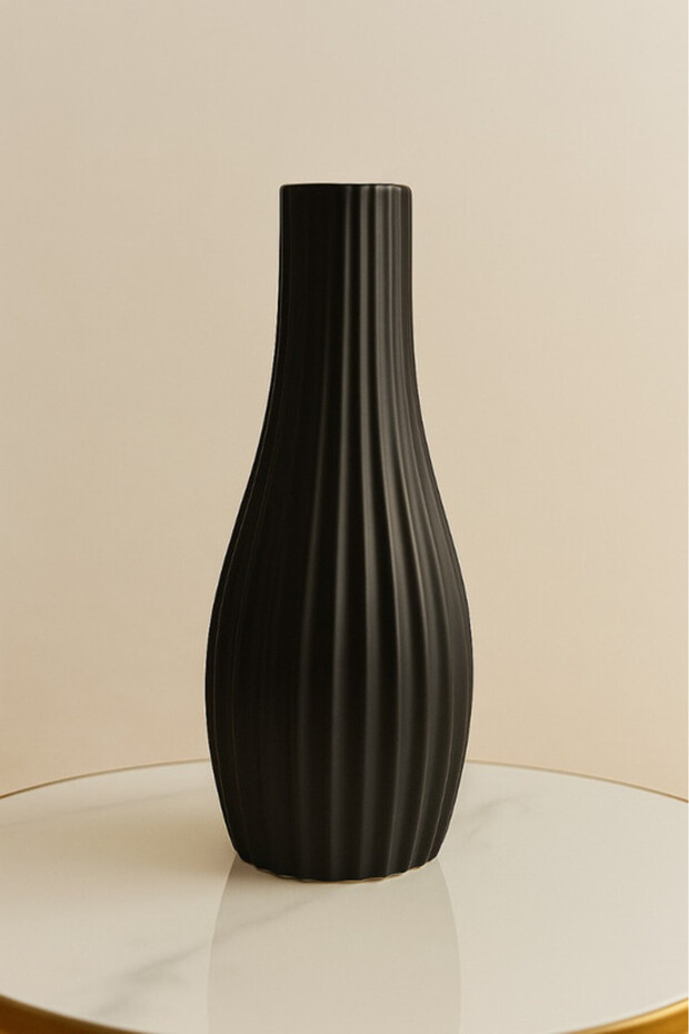 Black ceramic vase with a modern wavy design
