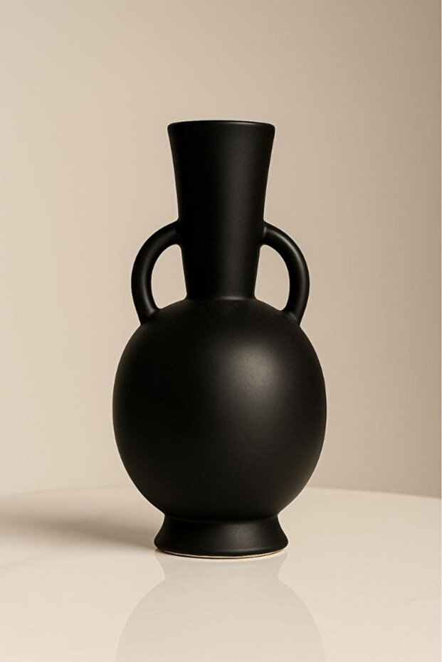 Decorative ceramic vase in matte black with two side handles
