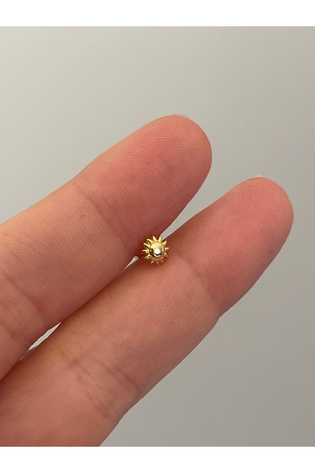 Gümüş güneş piercing