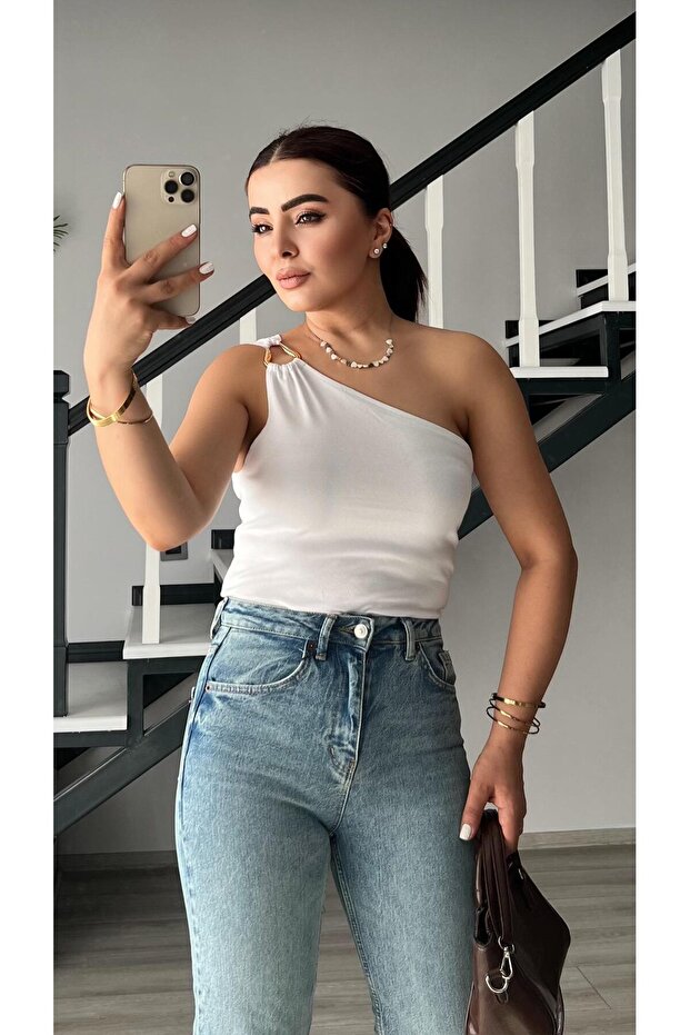 White one-shoulder blouse with accessory detail